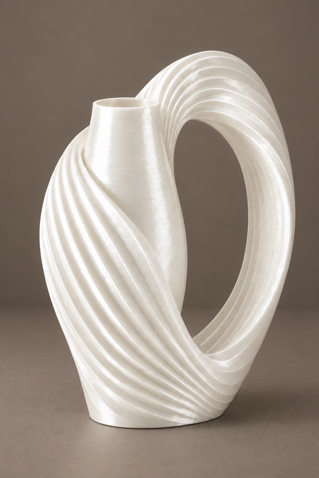 Ribbon Loop vase concept with an asymmetric pleated ribbon loop with one oval side window, front view, in the Silk Pearl White color direction. AI visualization.